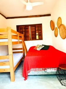 Ένα ή περισσότερα κρεβάτια σε δωμάτιο στο Falanga Suítes 2 +5 φωτογραφίες