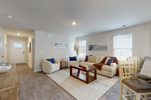 a living room with a couch and a table at Coastal Pines "2" in Ocean Isle Beach