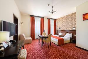 Postel nebo postele na pokoji v ubytování Hotel Aurum