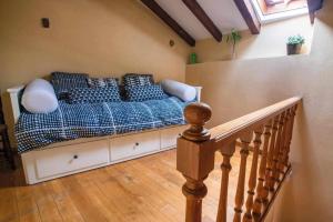 A bed or beds in a room at Casa Rural La Carrozal Senda del Oso