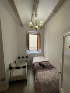 En eller flere senge i et værelse på Amplio apartamento en centro histórico