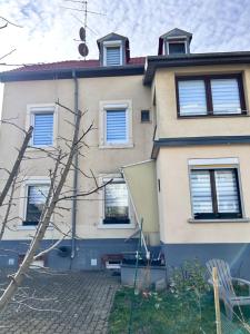 a house with blue shutters on it at Riedisheim Cozy in Riedisheim