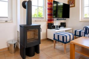 Fotografie z fotogalerie ubytování Urlaub Im Reethaus Delphin Mit Whirlpool Und Sauna v destinaci Beckerwitz