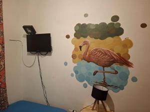 a wall with a painting of a turkey on it at Elisa Posada Hotel in Córdoba
