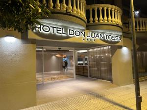 a building with a sign that reads motel don juan fosszsche at Hotel Don Juan Tossa in Tossa de Mar
