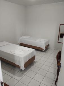 Rúm í herbergi á Hotel Bianchi