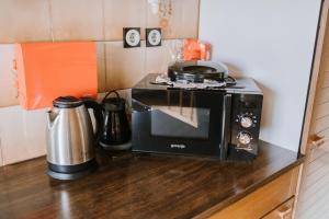 a microwave sitting on top of a kitchen counter at Apartment Skala with Magnificent view in Rečica ob Savinji +32 photos