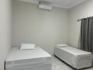 Katil atau katil-katil dalam bilik di Pousada Bandeirante