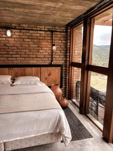 Ein Bett oder Betten in einem Zimmer der Unterkunft Monte Sião Château
