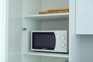 Kuchyňa alebo kuchynka v ubytovaní Modern 1-Bedroom Apartment ǀ AC, Free Parking