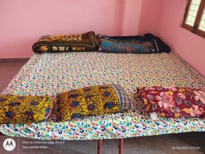 Postel nebo postele na pokoji v ubytování Homestay by Anand + 4 fotografie