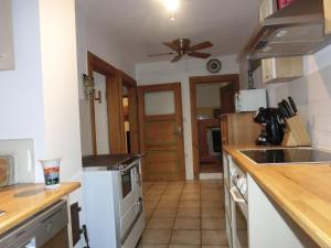 a kitchen with a sink and a stove at Ferienwohnung Lauf in Lauf an der Pegnitz +17 photos