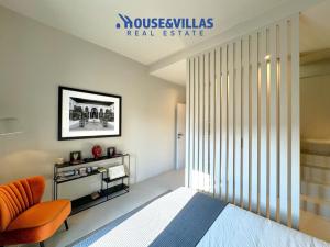 En eller flere senge i et værelse på House&Villas - Casa Lumae