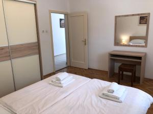 Postel nebo postele na pokoji v ubytování Erdgeschosswohnung Mit Terrasse Für Sechs Personen + 25 fotografií