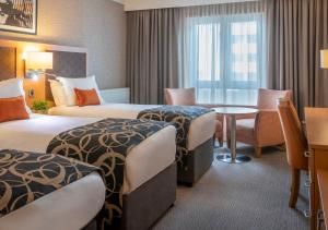 Ліжко або ліжка в номері Clayton Hotel Limerick