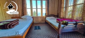 Ένα ή περισσότερα κρεβάτια σε δωμάτιο στο Luizen Homestay Kaffergaon