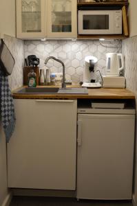 a kitchen with a sink and a counter top at Apartment 17 in Kassel