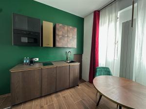 Kuchyň nebo kuchyňský kout v ubytování Maison Gucci