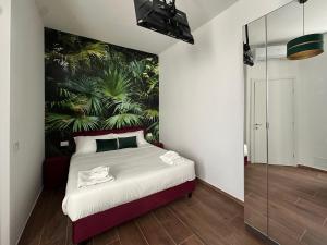 Postel nebo postele na pokoji v ubytování Maison Gucci + 3 fotografie