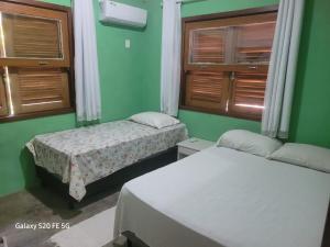 En eller flere senge i et værelse på Casa Martins