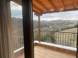 a balcony with a view of the mountains at Old Castle 3 in Palaiókastron
