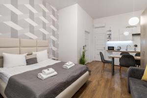 Postel nebo postele na pokoji v ubytování DeMar Apart Chehova