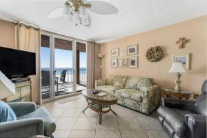 a living room with a couch and a tv at Buena Vista 302 by Vacation Homes Collection in Gulf Shores