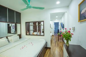 Voodi või voodid majutusasutuse Tung Trang Hotel toas