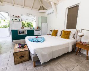 Kuchyň nebo kuchyňský kout v ubytování Mon'Désir Lodge - Bungalows