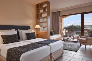 Postel nebo postele na pokoji v ubytování Aquila Rithymna Beach