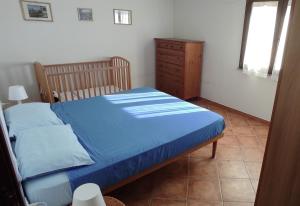 Ένα ή περισσότερα κρεβάτια σε δωμάτιο στο Casa Leonardo close to the beach