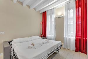 Postel nebo postele na pokoji v ubytování Il Rifugio in Corte