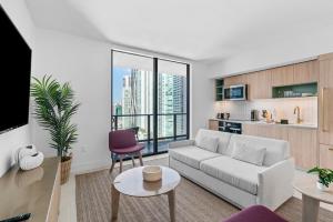 a living room with a couch and a table at Luxury 2-Bdrm Condo in the Heart of Downtown Miami in Miami
