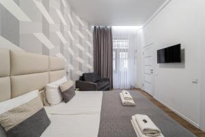 TV a/nebo společenská místnost v ubytování DeMar Apart Chehova