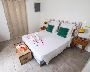 Postel nebo postele na pokoji v ubytování Mon'Désir Lodge - Bungalows