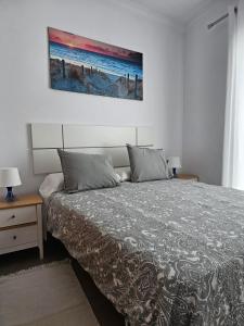 Ένα ή περισσότερα κρεβάτια σε δωμάτιο στο Apartamento AGUA AZUL