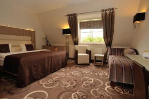 Postel nebo postele na pokoji v ubytování NordWest-Hotel Bad Zwischenahn
