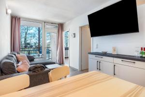 TV a/nebo společenská místnost v ubytování Ferienwohnung Leekee