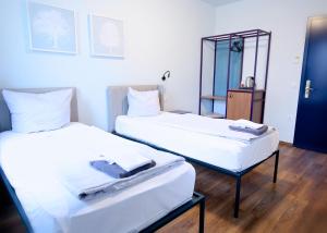 Postel nebo postele na pokoji v ubytování Das Schreder Hotel