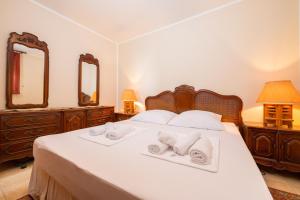 a bedroom with a bed with two towels on it at Sara in Zagorje