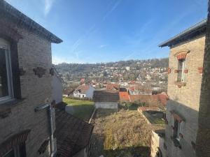 a view of a city from between two buildings at Les 3 Frontières Luxembourg Grand Parking Wifi in Herserange