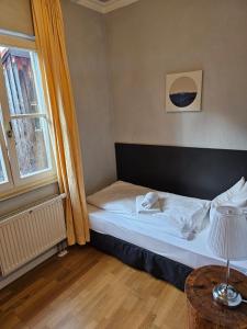Postel nebo postele na pokoji v ubytování Hotel Goldene Rose