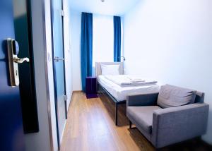 Postel nebo postele na pokoji v ubytování Das Schreder Hotel