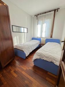Katil atau katil-katil dalam bilik di App4rent - Appartamento Equilio - pet friendly - giardino esclusivo