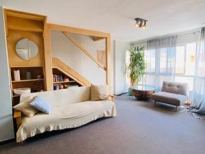 Postel nebo postele na pokoji v ubytování Golden Wave Surf