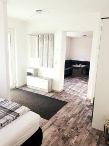 a white room with a bed and a desk at Apartment Bad Salzschlirf in Bad Salzschlirf