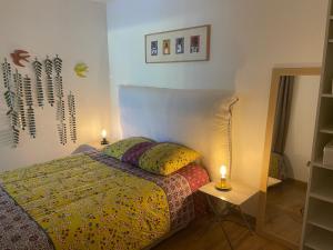 Ένα ή περισσότερα κρεβάτια σε δωμάτιο στο Vacances de rêve à Propriano Grand appartement avec jardin Vue sur le golfe