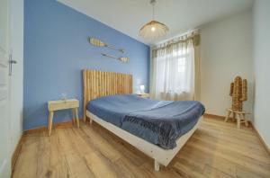 Ένα ή περισσότερα κρεβάτια σε δωμάτιο στο Appartement moderne