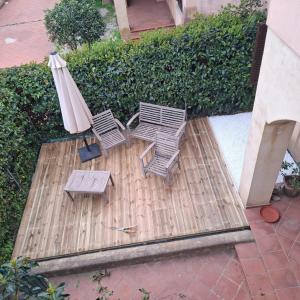 an overhead view of two chairs and an umbrella at Casa blu Arbatax con giardino e terrazza in Tortolì +23 photos