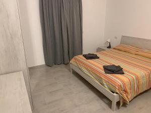 Postel nebo postele na pokoji v ubytování Luciano Home + 37 fotografií